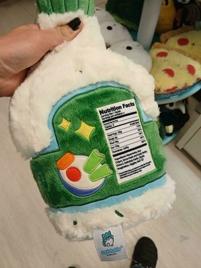 Plush hot sauce bottle with a humorous nutrition facts label, showcasing one of the most nonsensical things that actually exist.