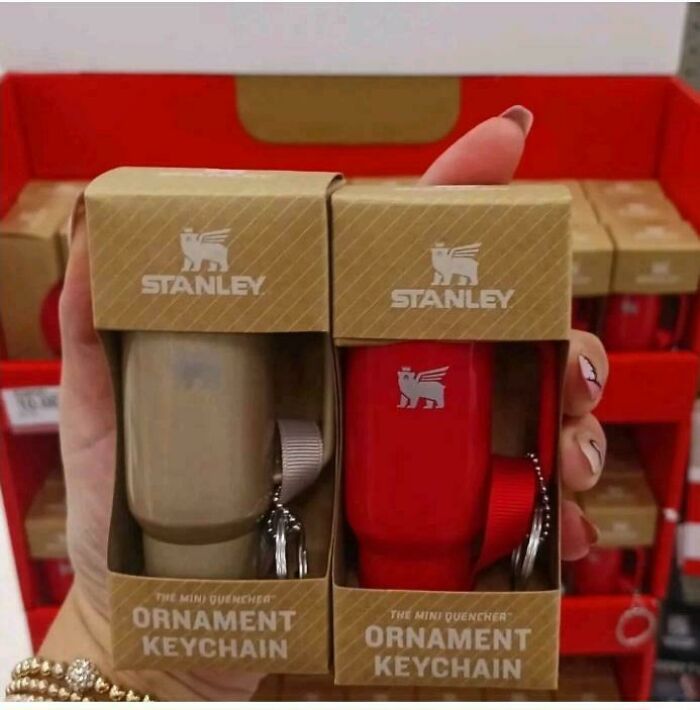 Mini quencher ornament keychain by Stanley, a nonsensical thing that actually exists, shown in beige and red.