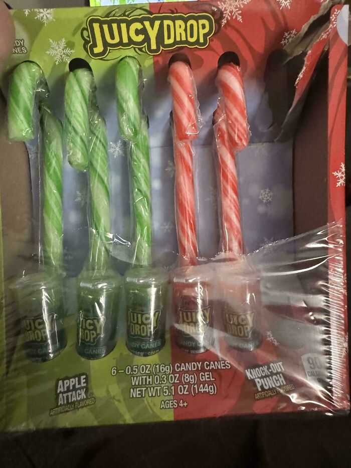 Juicy Drop candy canes with gel in apple attack and knock-out punch flavors, showcasing unique nonsensical candy products.