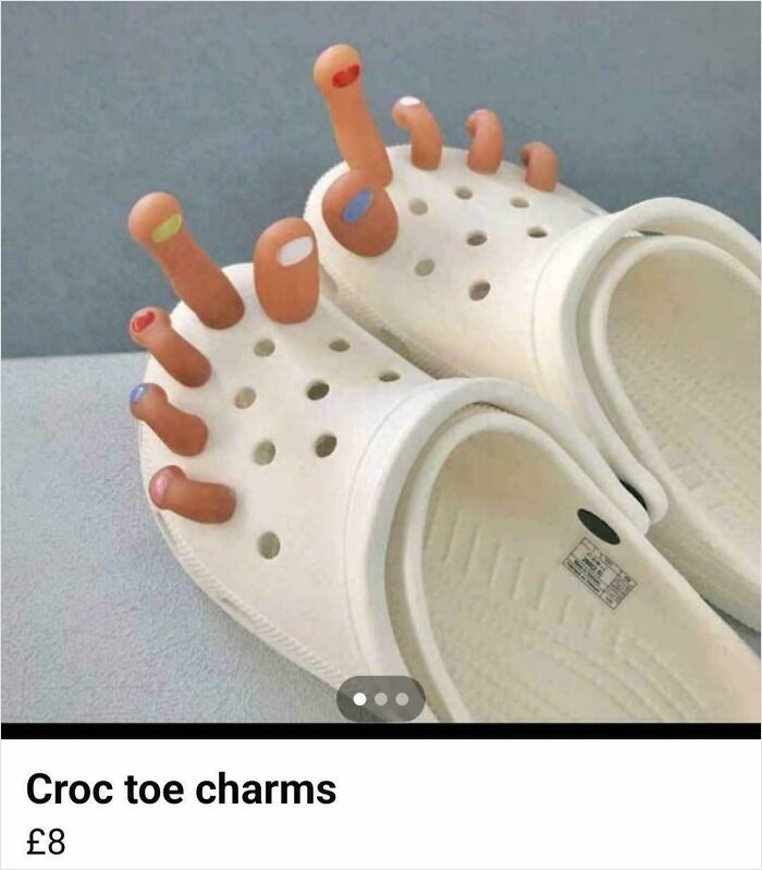 Croc shoes with nonsensical toe charms shaped like fingers, showcasing quirky and unusual wearable accessories.