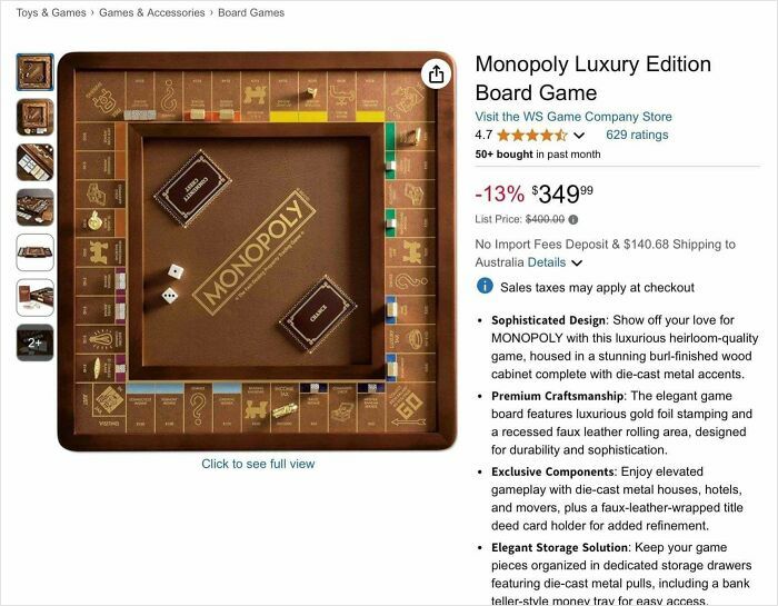 Monopoly luxury edition board game with gold foil stamping and die-cast metal accents in a wooden cabinet.