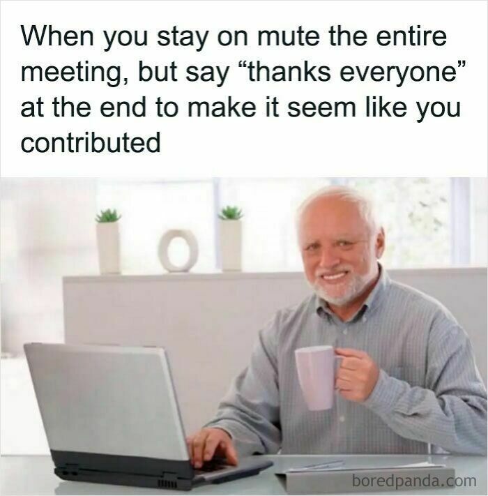 Man holding a mug and smiling at laptop, illustrating a work meme about staying on mute during meetings.