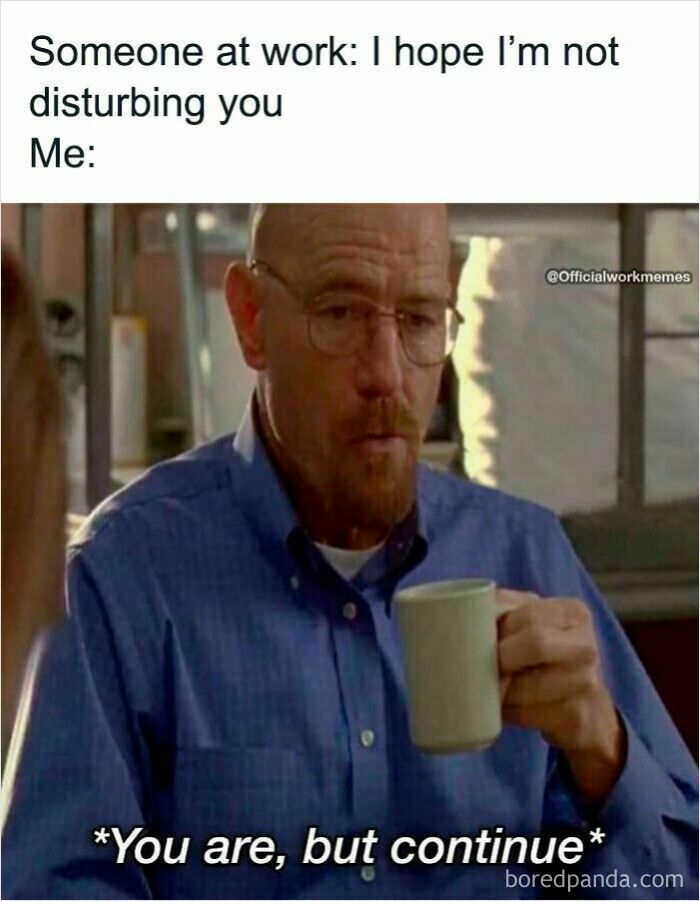Man in glasses holding a mug with a serious expression, depicting a work meme about being disturbed at work.