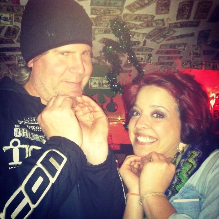 Two people posing with playful expressions in a decorated room, a humorous celebrity lookalike moment shared online.