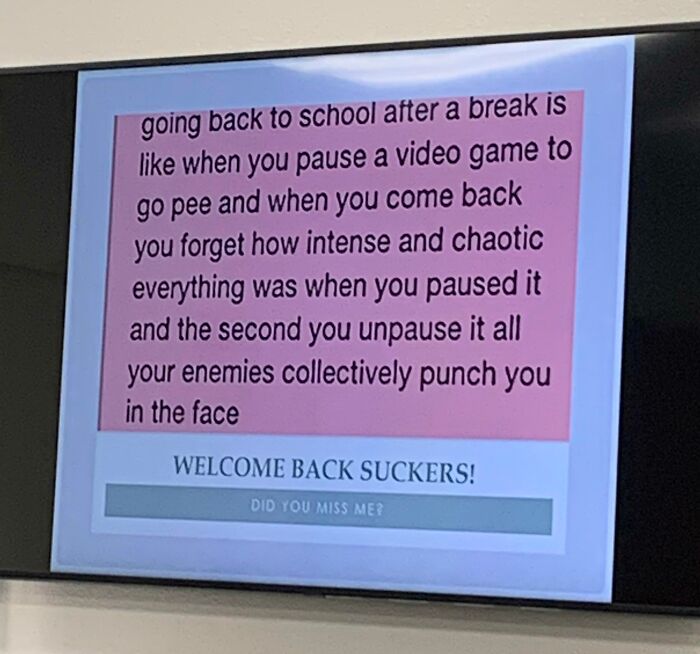 Slide with funny teacher humor comparing going back to school to pausing a video game with enemies attacking on unpause.