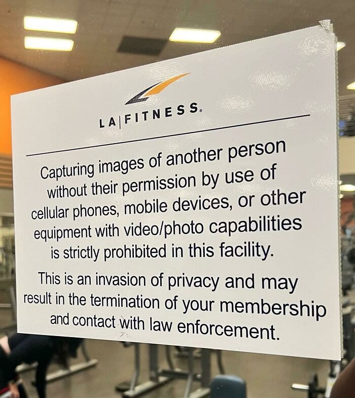 LA Fitness gym sign warning against unauthorized photo or video capture, emphasizing privacy and membership rules.
