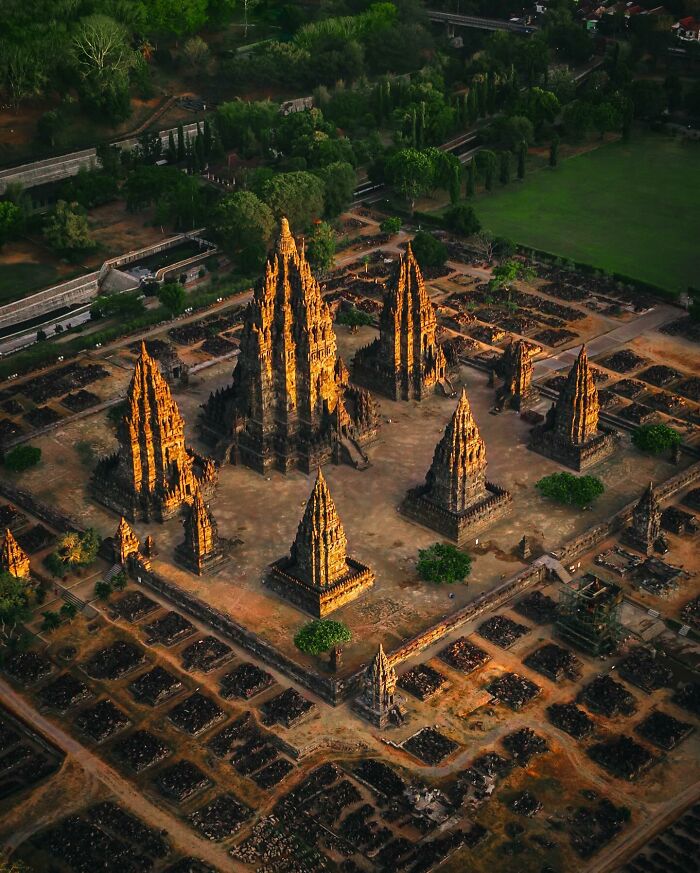 Ancient temple complex bathed in golden light, showcasing glimpses of everyday life in Asia through captivating architecture.