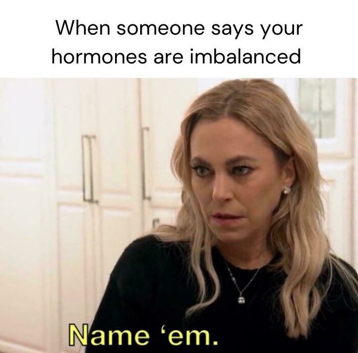 Woman with blonde hair looking serious indoors with text about hormones, illustrating fitness influencers taking babies to the gym.