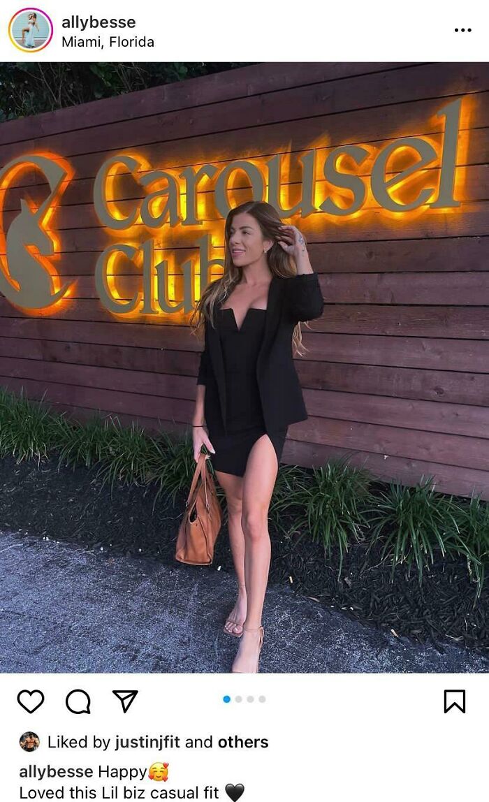 Woman dressed in a black outfit standing outside a gym, representing fitness influencers taking their baby to the gym.