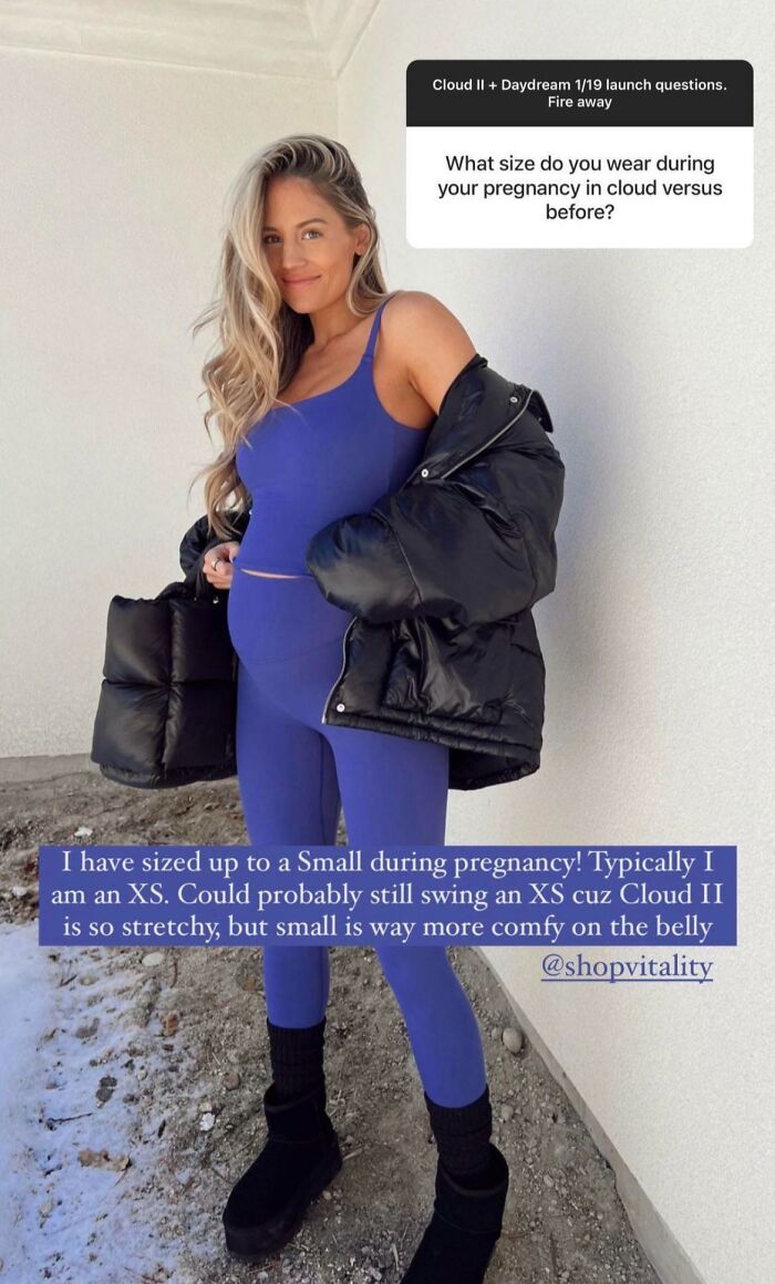 Pregnant fitness influencer in blue workout clothes and a black jacket, promoting comfortable gym wear for pregnancy.