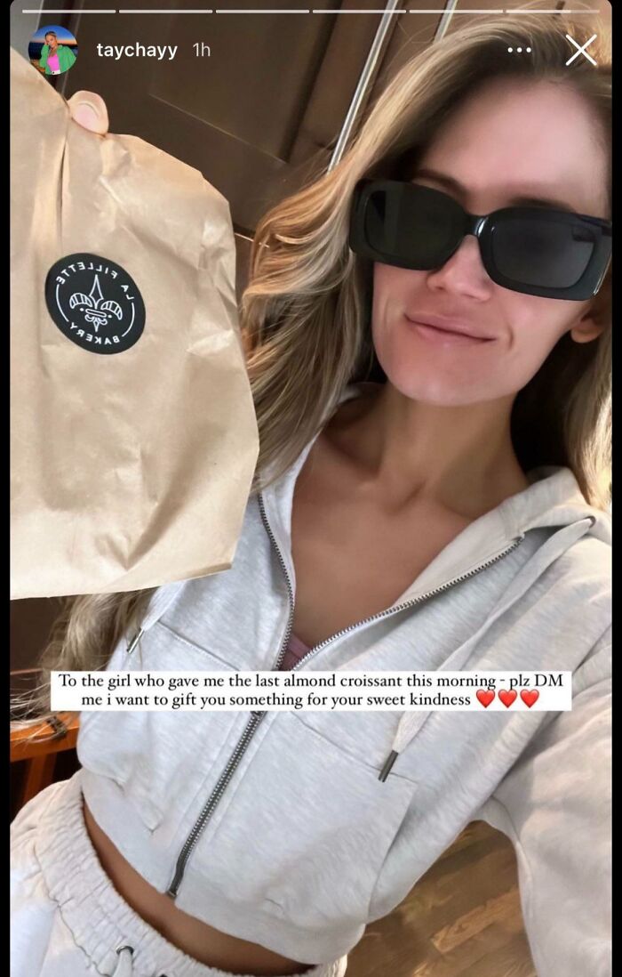 Woman in casual fitness wear holding a bakery bag, relating to take your baby to the gym fitness influencers theme.