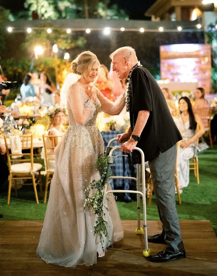 Elderly man and woman sharing a heartfelt moment at an event, showcasing funny and wholesome parents moments.