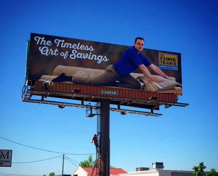 Funny and weird billboard showing a man stretching on a carpet with the text The Timeless Art of Savings.