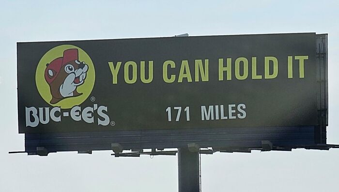 Funny and weird billboard for Buc-ee’s with slogan You Can Hold It, located 171 miles away on a highway.