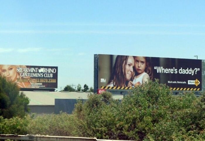 Two large billboards visible from a highway, illustrating funny and weird billboard advertising examples.