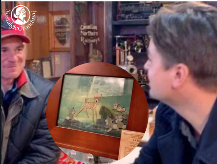 Two men smiling and looking at a display featuring inspiring facts about nature, better than watching the news.