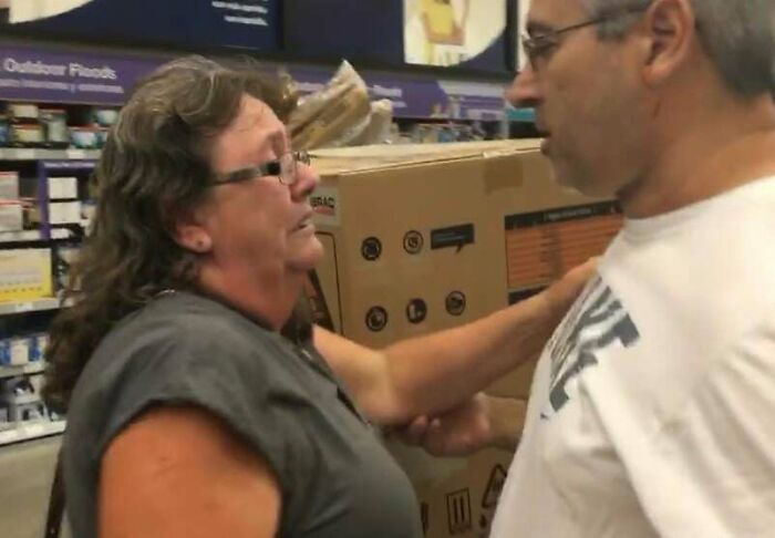 Two people in a store having a serious conversation, illustrating inspiring facts better than watching the news.