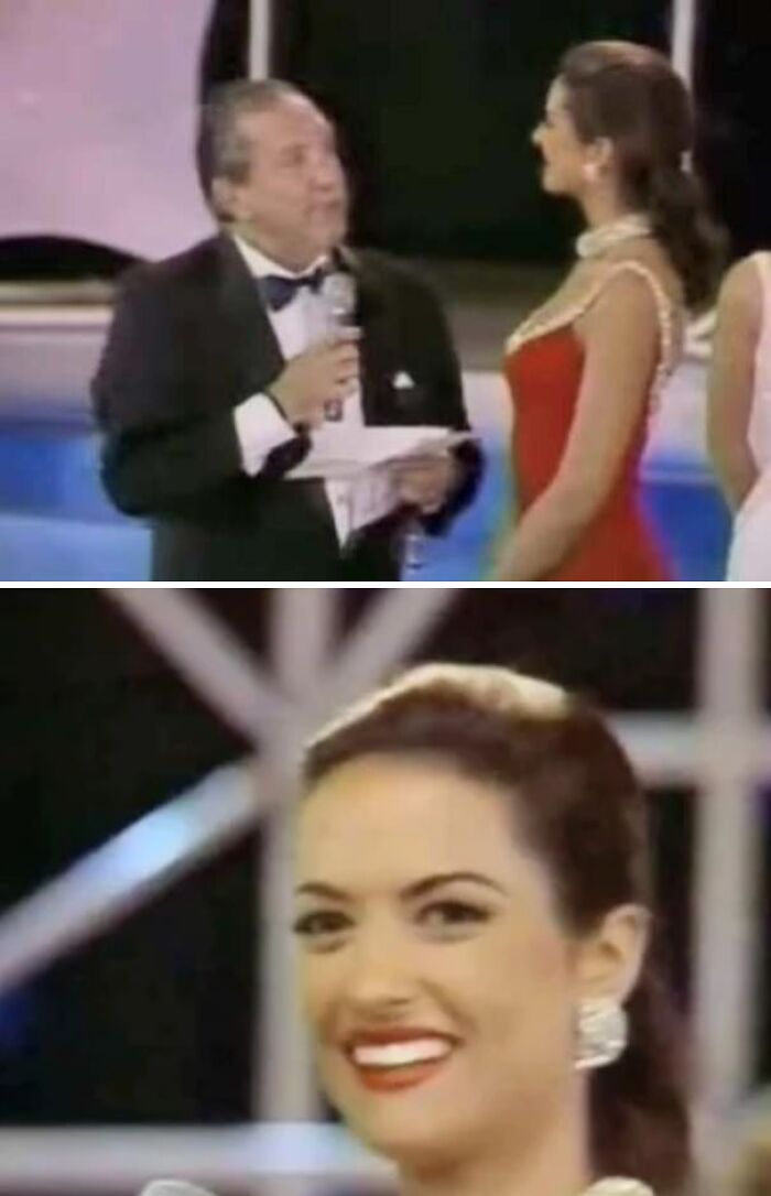 Man in tuxedo interviewing woman in red dress at event, smiling, capturing inspiring facts mood better than watching news.