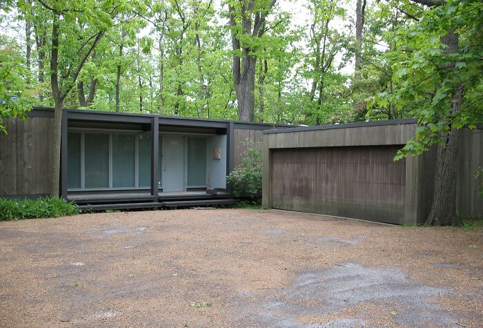 Modern TV house exterior surrounded by trees, showcasing one of the iconic TV houses that exist in real life.