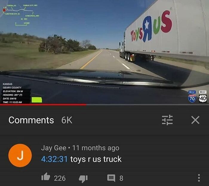 Dashboard view of a Toys R Us truck on highway with popular YouTube comment highlighting funny moments.