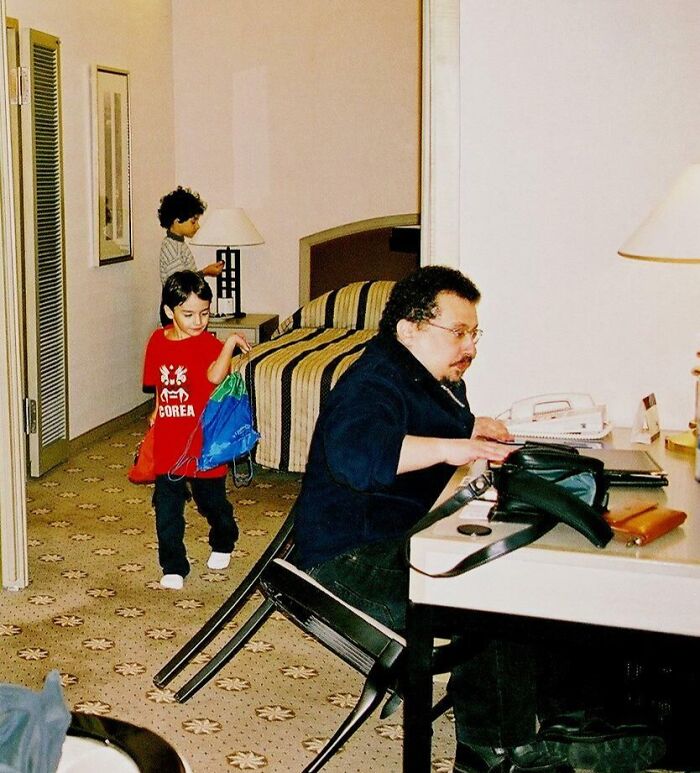 Man about to fall backward as chair tips over in chaotic moment capturing the split second before disaster hits humorously.