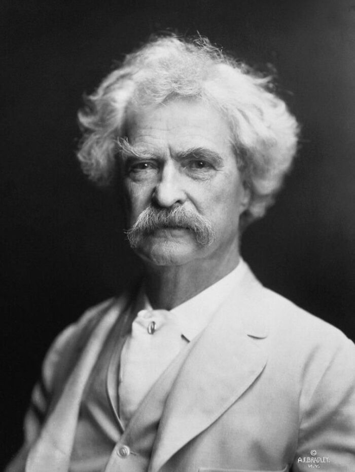 Portrait of an older man with white hair and mustache illustrating famous historical quotes in black and white.