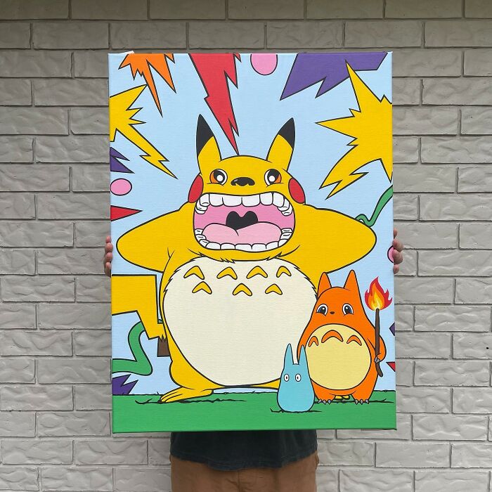 Colorful pop mash artwork with cartoon character mash-ups blending Pikachu and Totoro styles held against a brick wall background.