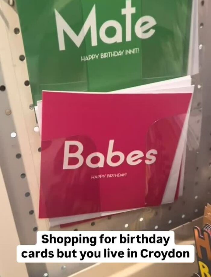 Greeting cards with UK slang phrases on display, reflecting great London memes and British humor culture.