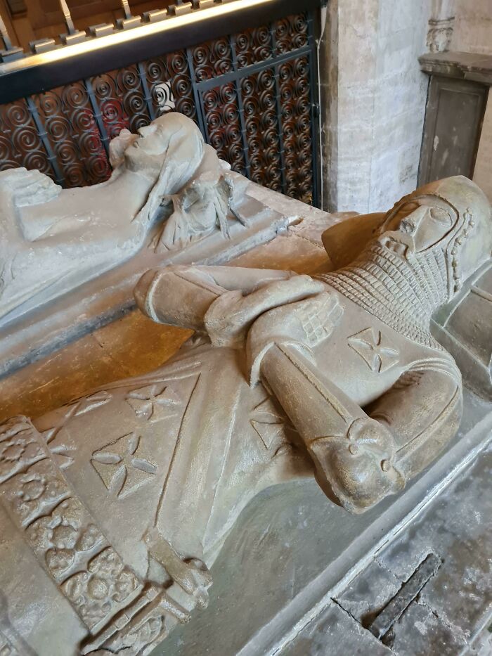 Medieval history enthusiasts' joy captured in detailed medieval knight and noble stone effigies in historic setting.