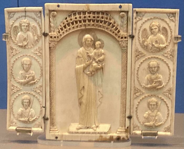 Carved medieval ivory triptych featuring religious figures, illustrating medieval history enthusiasts' interest in artifacts.