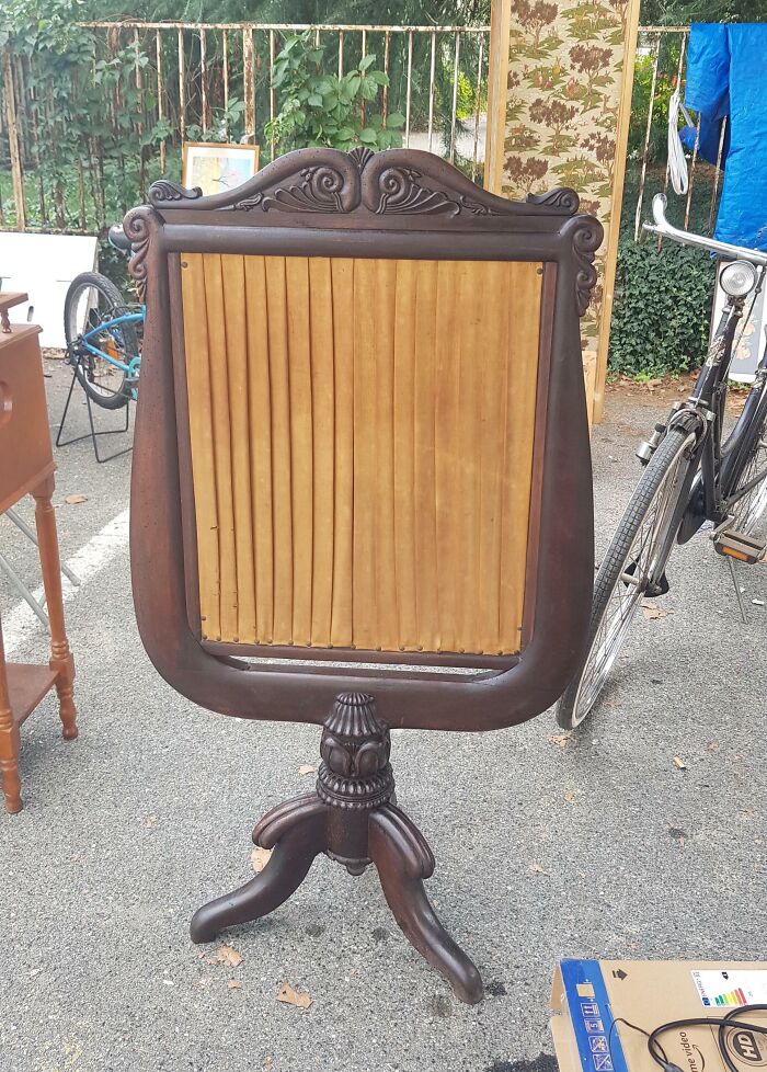 Antique wooden stand with an old pleated panel found vintage item with unknown purpose at a flea market.