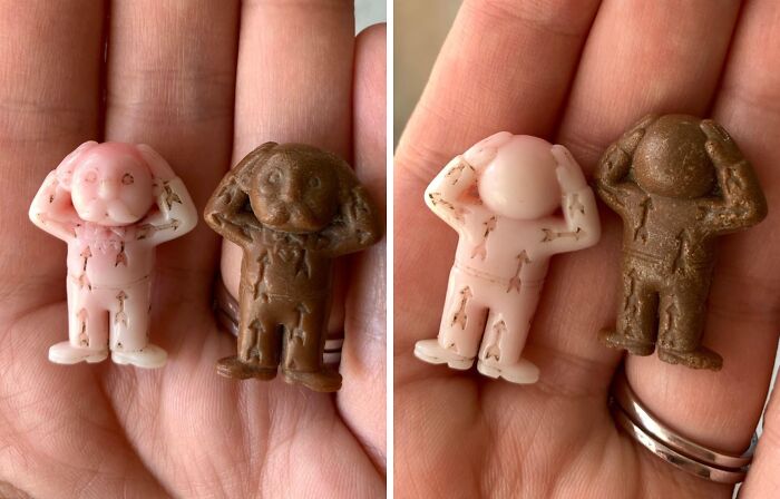 Two small vintage plastic figurines in pink and brown held in a hand, unknown old objects with internet help.