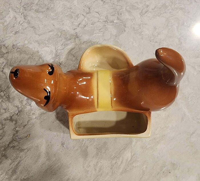 Vintage ceramic dog-shaped planter with a hollow center, found old object with uncertain purpose sought online identification help
