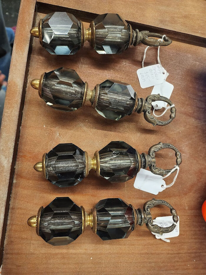 Set of four vintage faceted glass and brass drawer pulls found old with no clue, showcasing antique hardware detail.