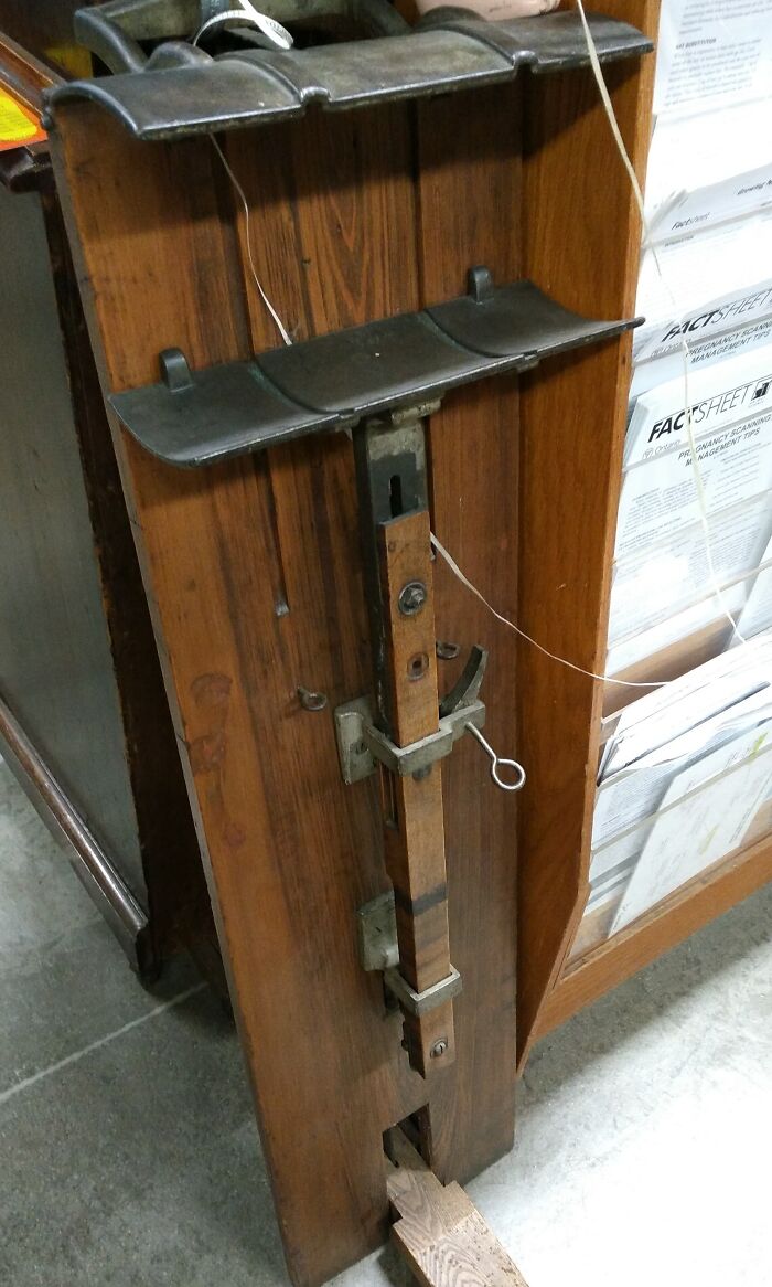 Old wooden and metal artifact found unknown, part of a collection showing people discovering something old with internet help.