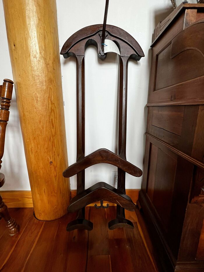 Old wooden furniture piece with mysterious design, found by people with no clue what it is, shared online for identification.