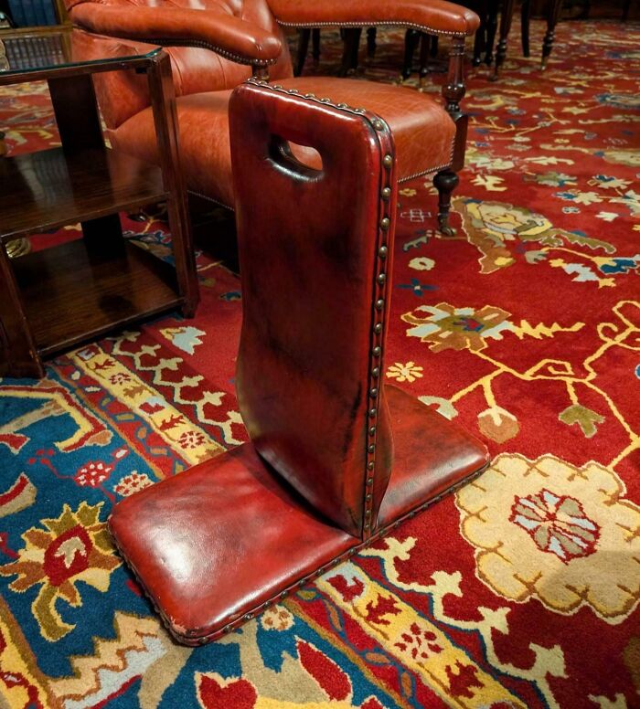 Vintage leather object on patterned carpet, an old item found with no clue what it was, puzzling internet users.