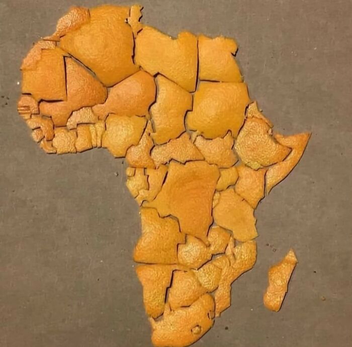 Orange peel pieces arranged to form a humorous and inaccurate map of Africa, showcasing funny map distortions.