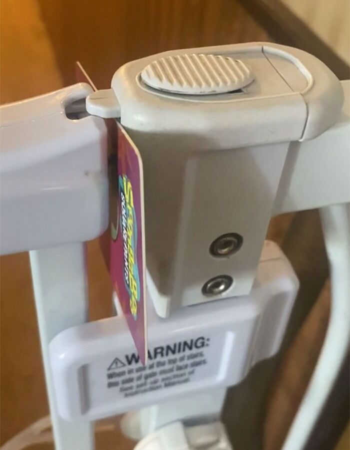 Child invention using a creative locking mechanism on a safety gate, showcasing impressive kids' invention skills.