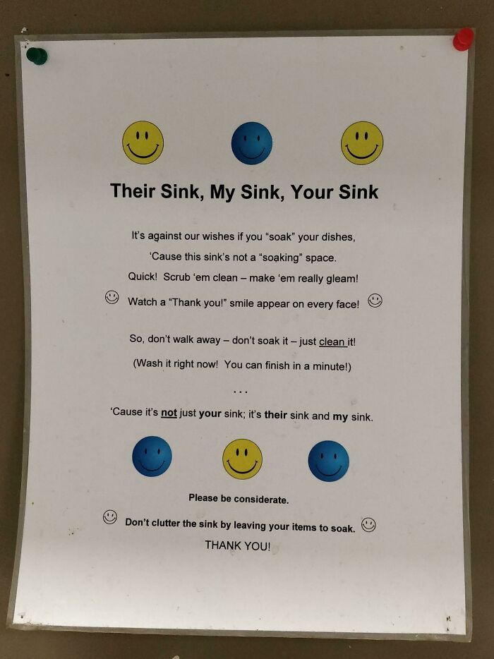 Passive-aggressive coworker note about keeping the shared sink clean and not soaking dishes with smiley face icons.