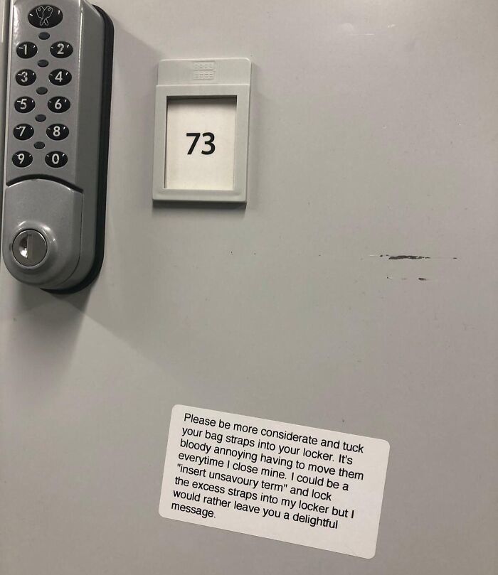 Locker with a passive-aggressive note from a coworker about tucking bag straps in, highlighting workplace frustration.