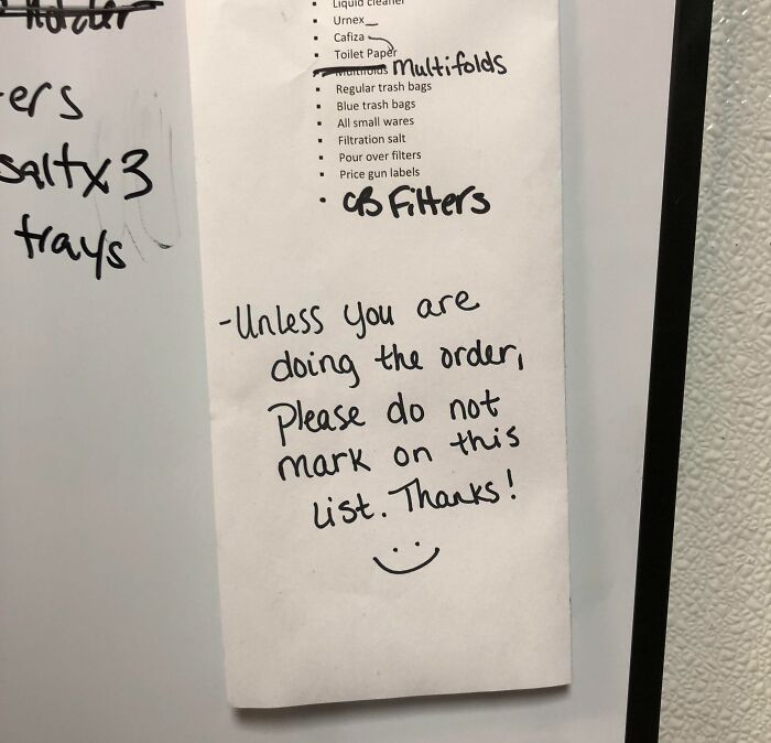 Passive-aggressive coworker note on order list asking not to mark unless handling the order on a whiteboard.