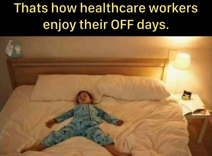 Child in pajamas lying spread out on a large bed illustrating the struggle and humor of working in medicine.