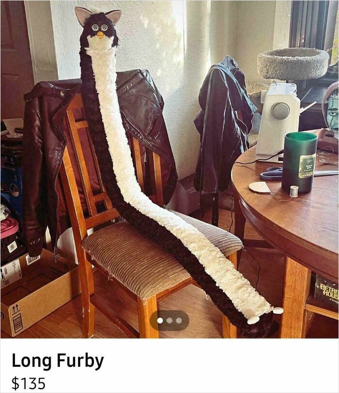 Plush long Furby toy displayed on a chair as an example of unhinged things people thought they could sell online.