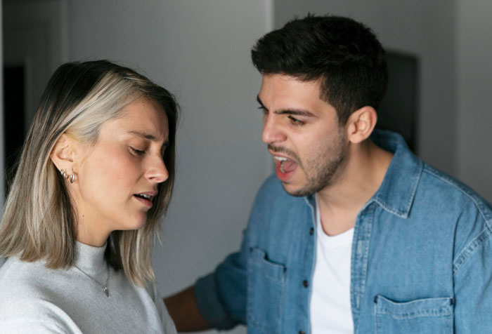 Man angrily yelling at wife who looks upset and disappointed, capturing his blatant hatred and resentment toward her. Man angrily yelling at wife who looks upset and disappointed, capturing his blatant hatred and resentment toward her.