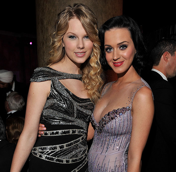 Two women dressed in elegant gowns at a formal event, related to Travis Kelce&rsquo;s answer about Taylor Swift.