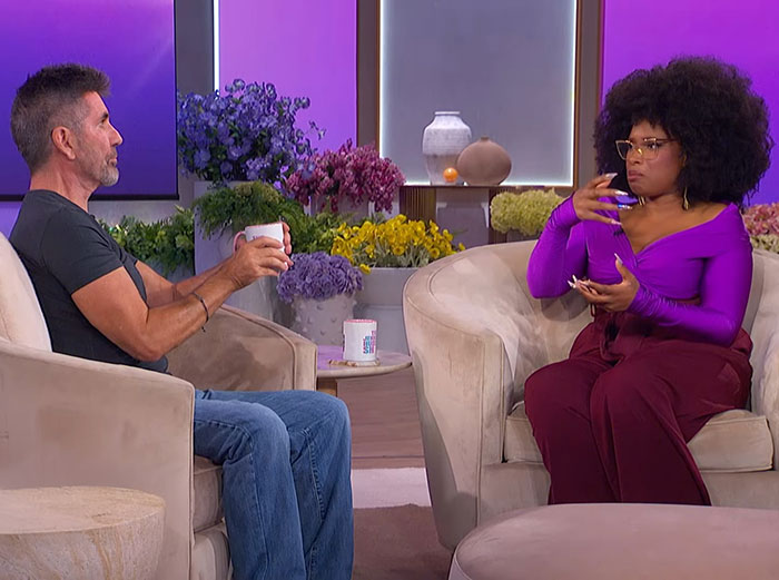 Simon Cowell discussing his bike accident and survival during a casual talk show interview with a female host.