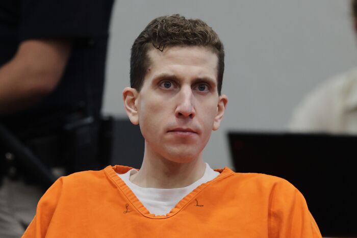 Bryan Kohberger in an orange prison jumpsuit appearing in court related to Idaho crimes discussed with his mom before arrest.