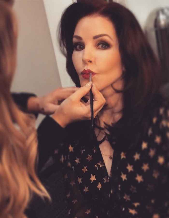 Lisa Marie Presley having makeup applied, highlighting the lawsuit revealing her heartbreaking final moments.