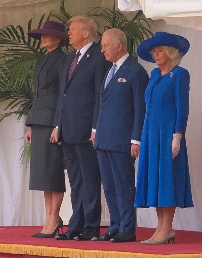 Queen Camilla and Kate Middleton stand with Donald Trump and King Charles during a formal event amid controversy.